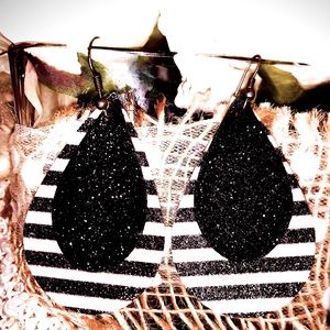 Handcrafted leather/faux leather tear earrings.